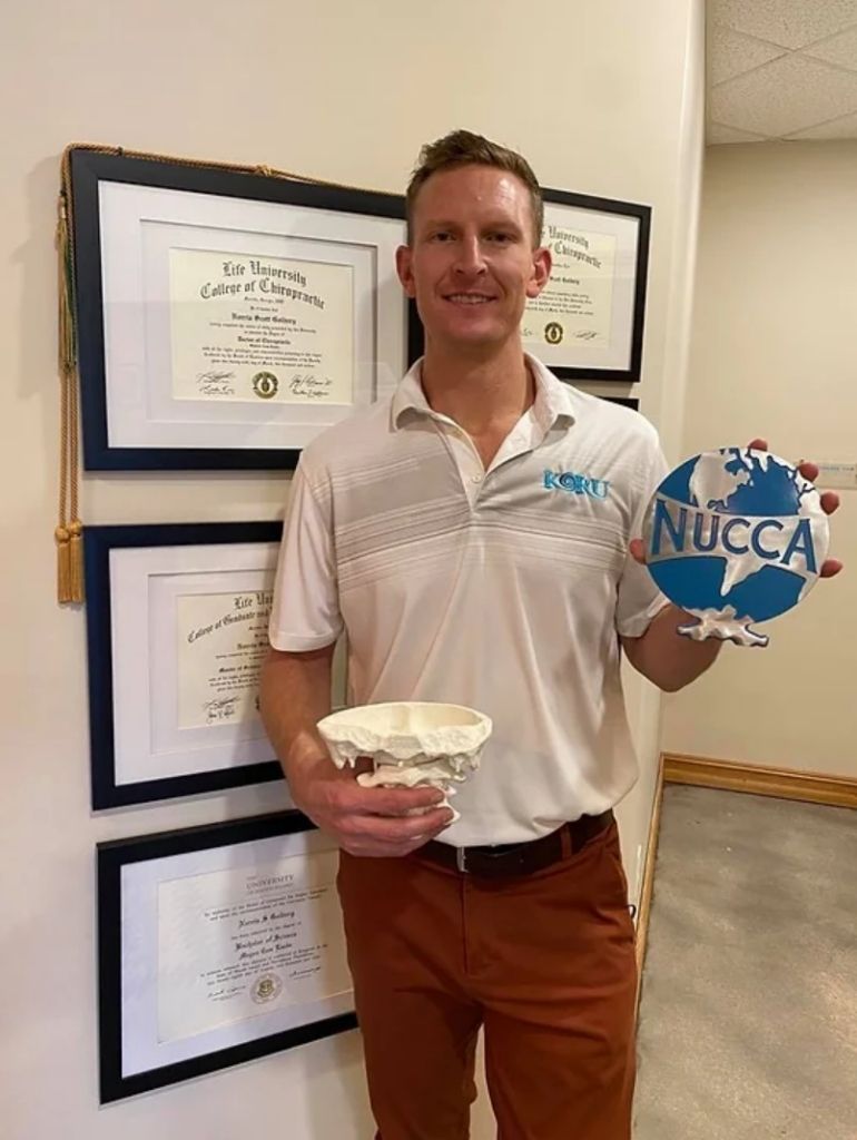 dr norris with a nucca plaque