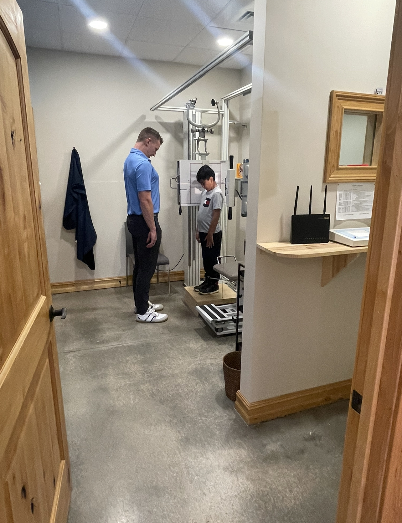 chiropractor performing diagnostic x-rays on a child 