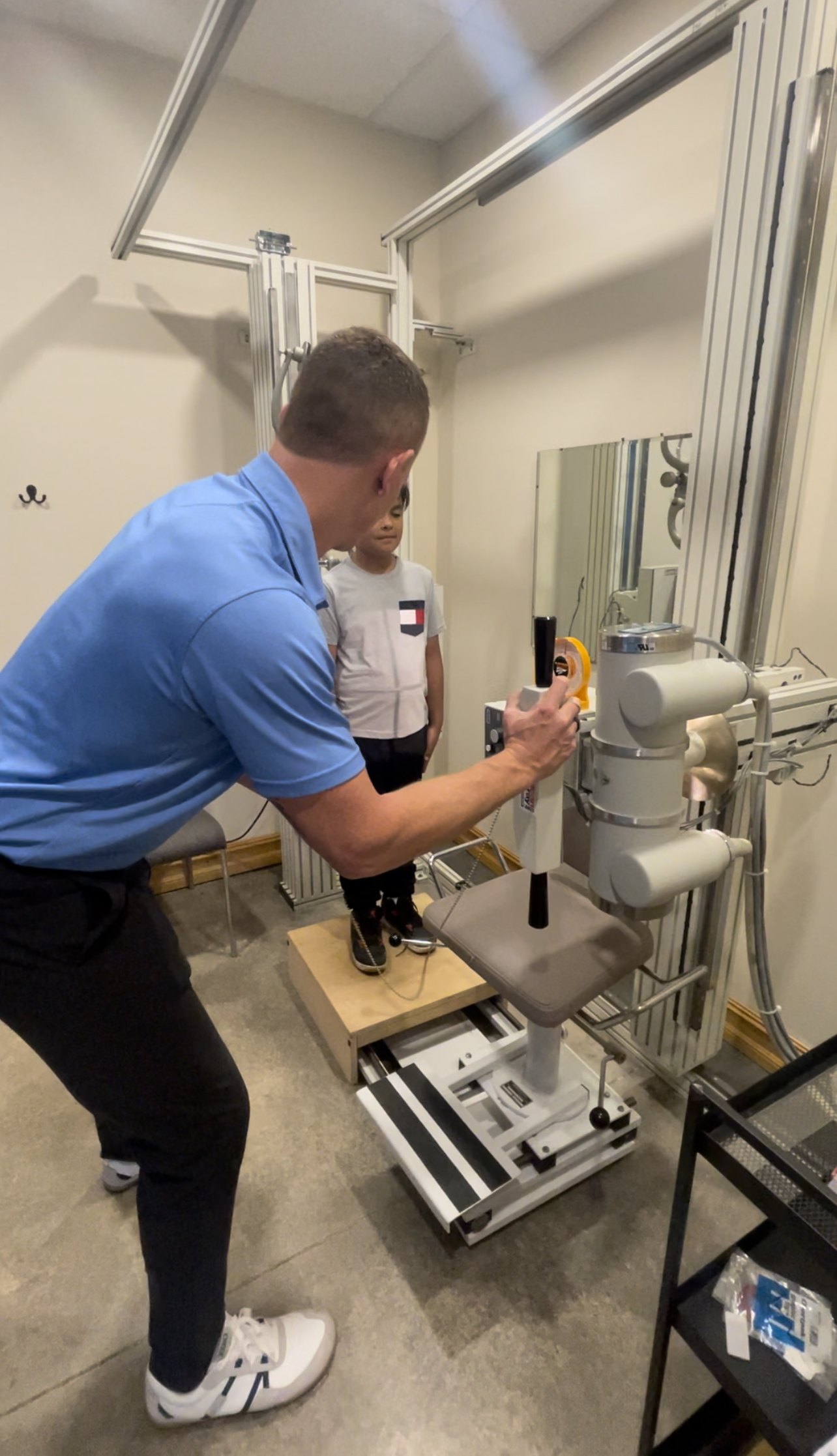 x-rays being performed on a child by a chiropractor in louisville, co 