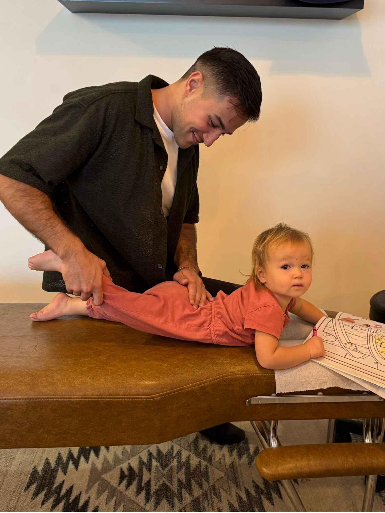 chiropractor in louisville co adjusting an infant